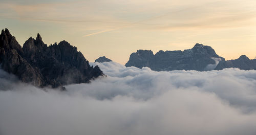 Scenic view of mountains against sky during sunset. tre cime dolomite italy