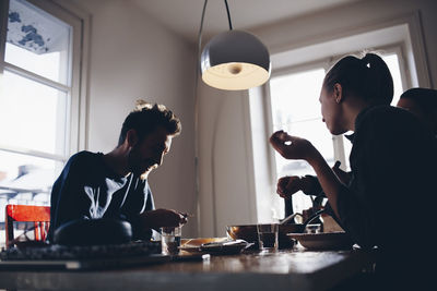 Man and woman sitting at table