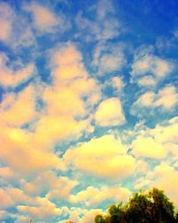 Low angle view of cloudy sky at sunset