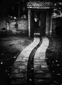 Empty walkway in front of building