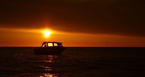 Scenic view of sea at sunset