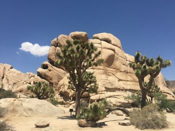 Rock formation in desert against clear blue sky