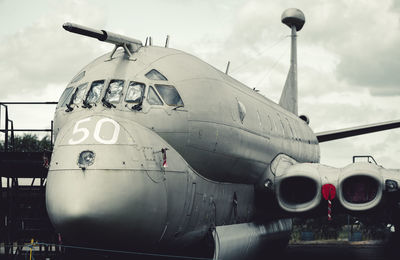 Close-up of airplane against sky