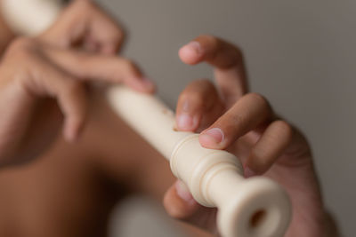 Midsection of woman holding nail