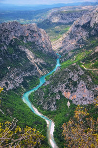 High angle view of road amidst land and mountains