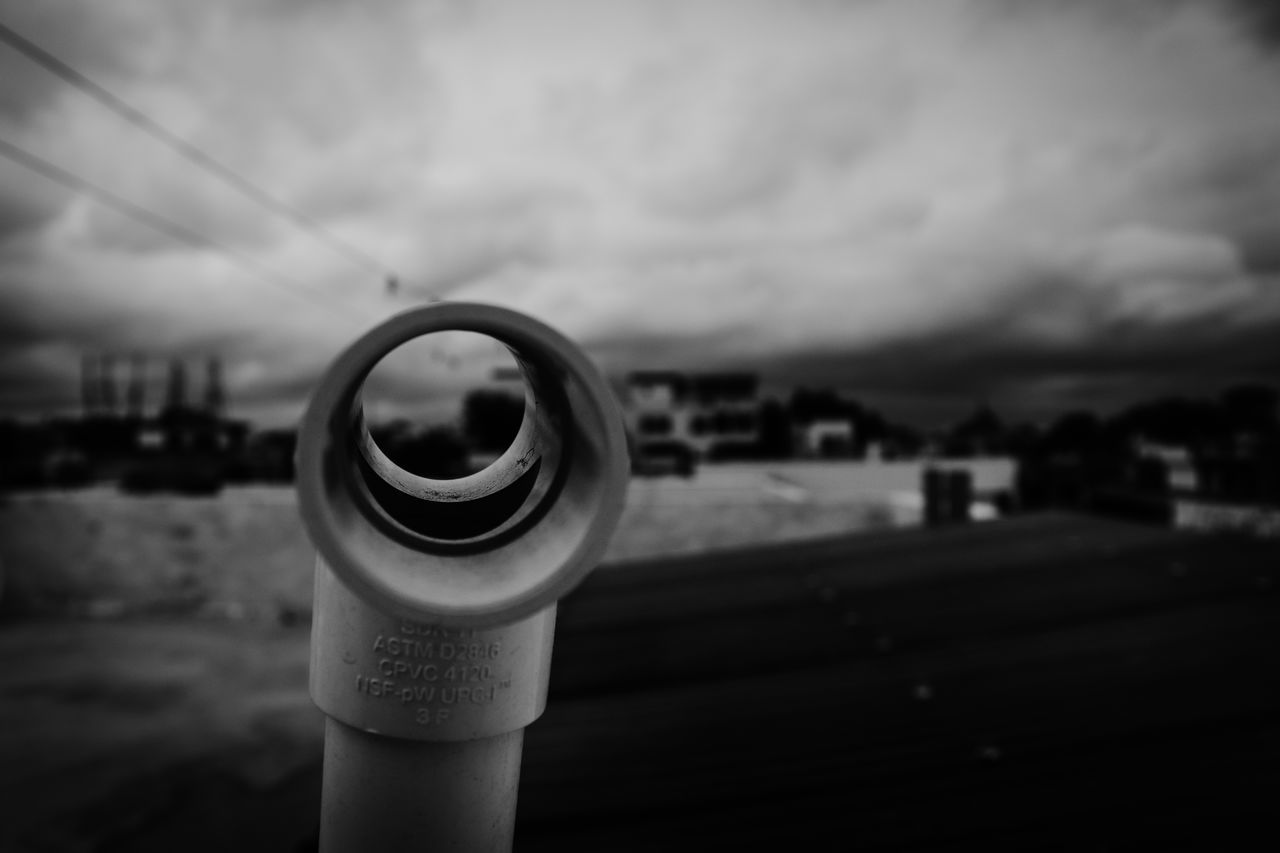 CLOSE-UP OF WATER BOTTLE AGAINST SKY