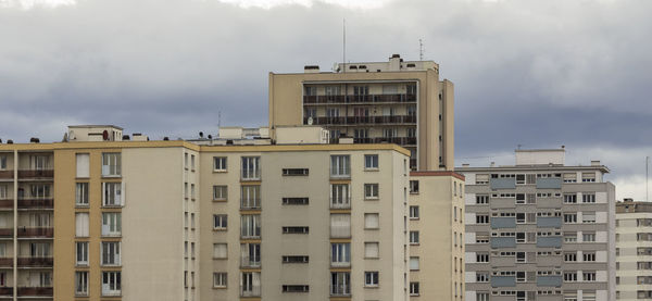 Buildings in city against sky