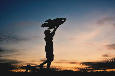 Silhouette of boy during sunset