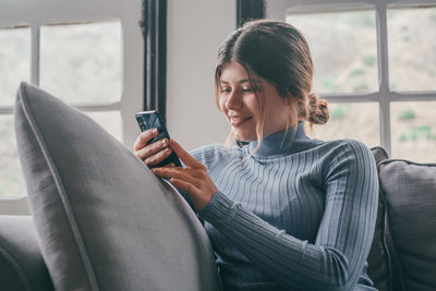 Young woman using mobile phone