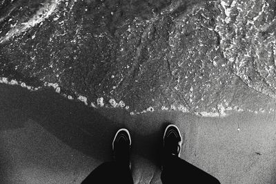 Low section of person standing on ground