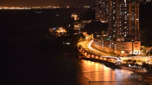 High angle view of illuminated buildings in city at night