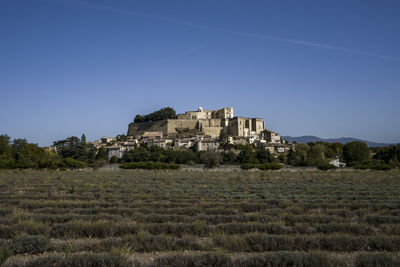 The famous typical grignan village in provence at sunrise from above - france