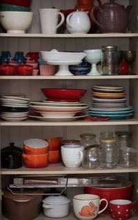 Stack of multi colored shelf in kitchen