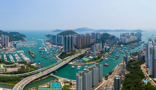 High angle view of city buildings against clear sky