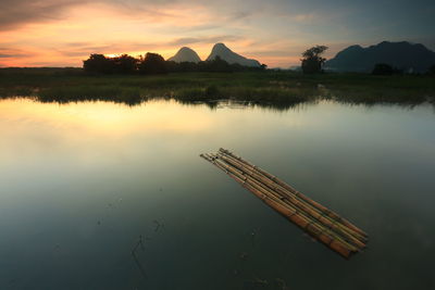 Scenic view of lake against sky during sunset