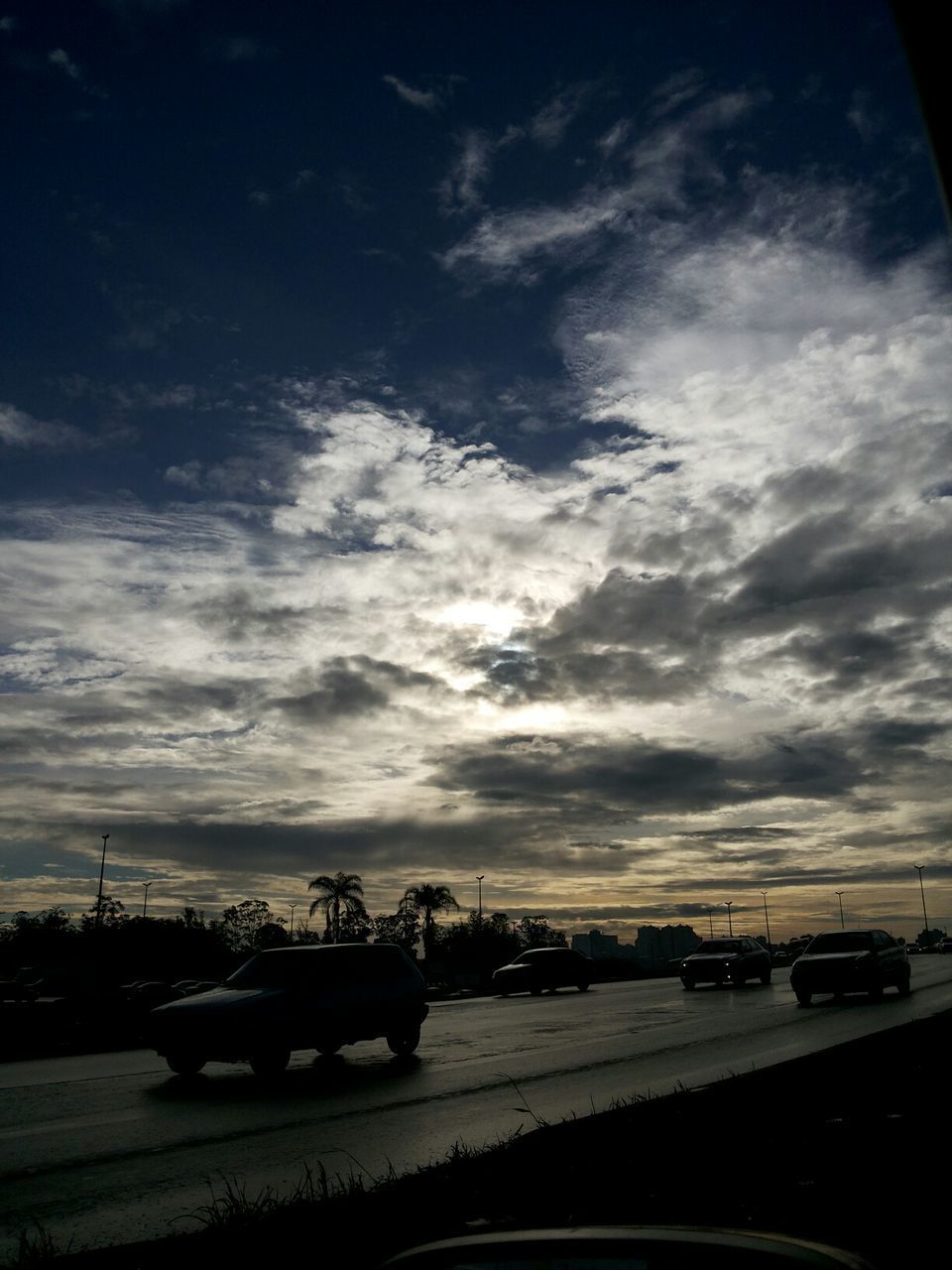 transportation, mode of transport, car, land vehicle, sky, cloud - sky, road, cloudy, on the move, silhouette, travel, cloud, nautical vessel, street, sunset, dusk, no people, outdoors, nature, vehicle interior