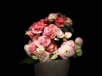 Close-up of pink rose bouquet against black background