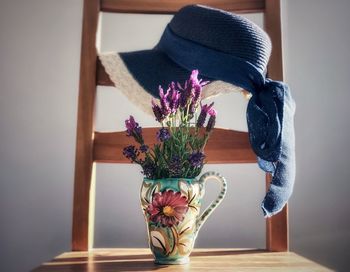 Close-up of flower vase on table at home