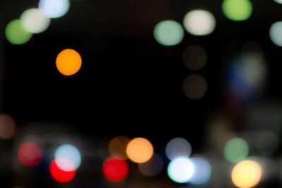 Defocused image of illuminated lights at night