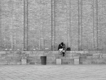 Rear view of man on wall