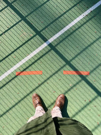 Low section of man standing on floor