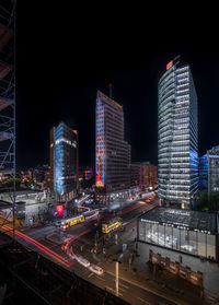 High angle view of illuminated buildings in city at night