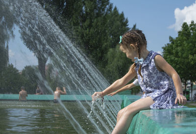 People enjoying in swimming pool