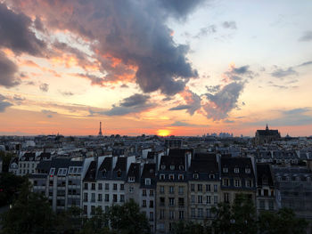 High angle view of buildings against sky during sunset