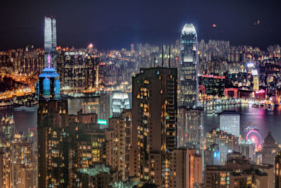 Digital composite image of illuminated buildings in city at night