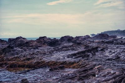 Volcanic landscape against sky