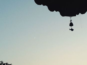 Low angle view of balloons against sky at night