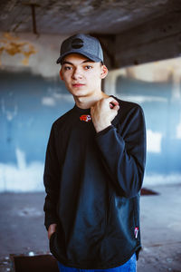 Portrait of young man standing outdoors