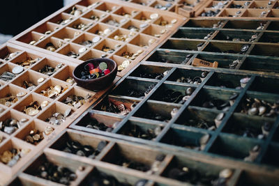 High angle view of rings in containers