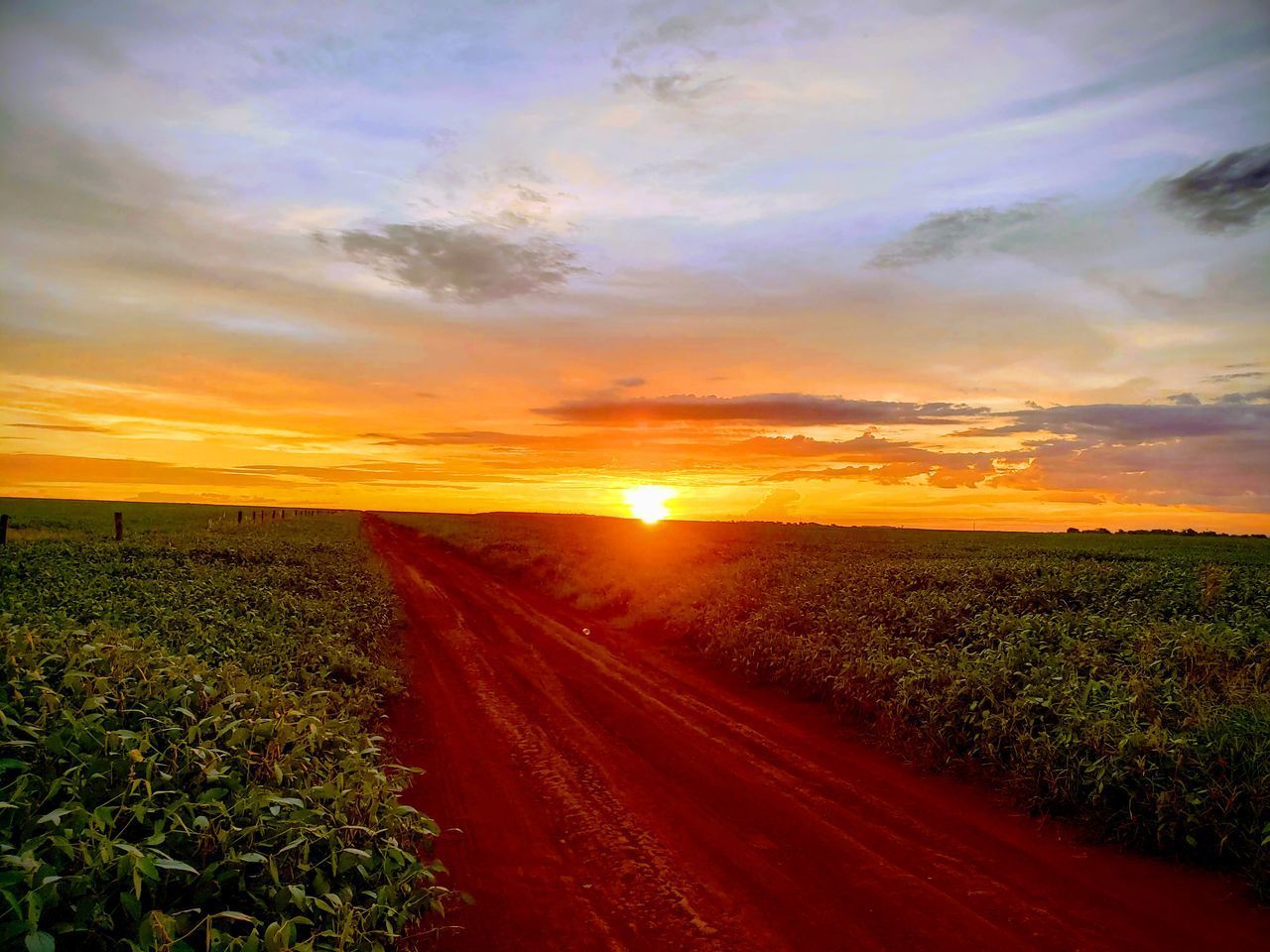 SCENIC VIEW OF ROAD AGAINST SKY DURING SUNSET