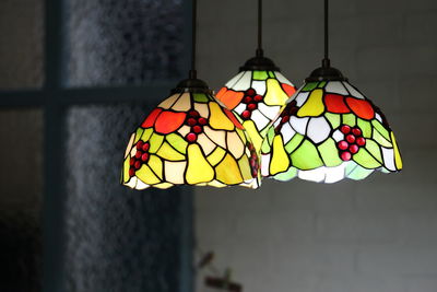 Illuminated pendant lights hanging at home