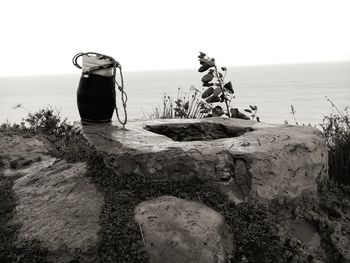 View of rocks on beach against sky