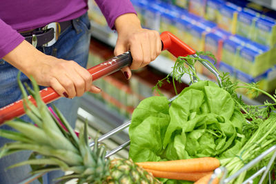 Midsection of man preparing food