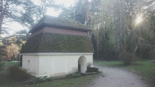 Built structure on landscape against sky