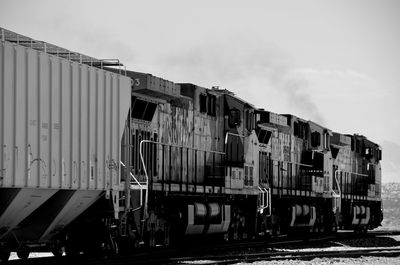 Train on railroad track against sky