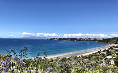 Scenic view of sea against blue sky