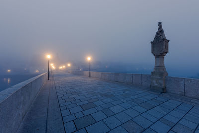 Street lights on footpath at night