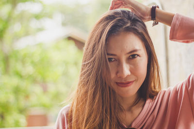 Close-up portrait of smiling mid adult woman