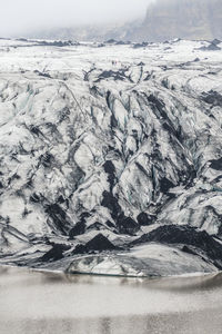 Myrdalsjökull glacier covered by volcanic ashes