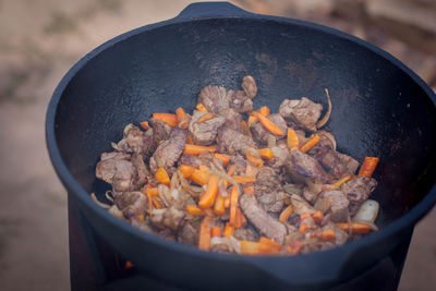 High angle view of meat on barbecue grill