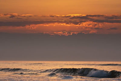 Scenic view of sea against sky during sunset