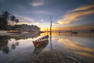 Scenic view of lake against sky during sunset