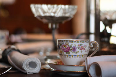 Close-up of coffee cup on table