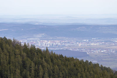 High angle view of sea and cityscape against sky