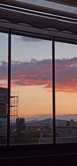 Scenic view of sunset seen through window