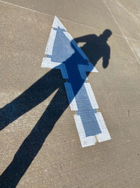 High angle view of person shadow on street